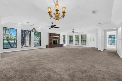 Freshly updated and move-in ready! This 3-bed, 2-bath home in on Hide-A-Way Lake Golf Course in Texas - for sale on GolfHomes.com, golf home, golf lot
