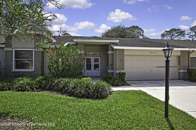 Welcome to this bright and spacious Oakmont villa located in the on Timber Pines Golf Course in Florida - for sale on GolfHomes.com, golf home, golf lot