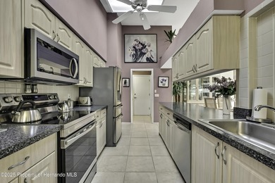 Welcome to this bright and spacious Oakmont villa located in the on Timber Pines Golf Course in Florida - for sale on GolfHomes.com, golf home, golf lot