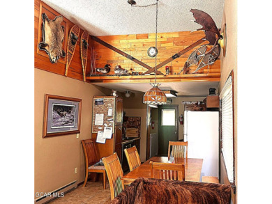 This 3bd/2ba Columbine Lake home on a 1/3 acre lot is situated on Grand Lake Golf Course in Colorado - for sale on GolfHomes.com, golf home, golf lot