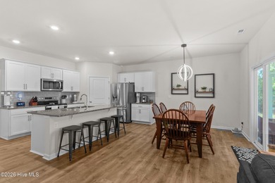 Nestled on a quiet cul-de-sac, this single-level four-bedroom on Harbour Point Golf Club in North Carolina - for sale on GolfHomes.com, golf home, golf lot