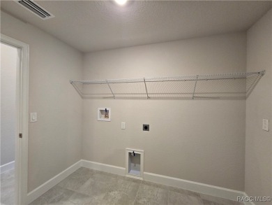 Handsome, inviting, and move-in ready, this 3-bedroom, 2-bath on Twisted Oaks Golf Club in Florida - for sale on GolfHomes.com, golf home, golf lot