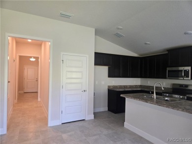 Handsome, inviting, and move-in ready, this 3-bedroom, 2-bath on Twisted Oaks Golf Club in Florida - for sale on GolfHomes.com, golf home, golf lot