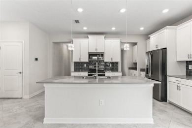 Don't miss out on this stunning 5-bed, 4.5-bath, 3,800+ sq ft on The Oasis Club at Champions Gate in Florida - for sale on GolfHomes.com, golf home, golf lot