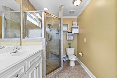 This thoughtfully designed 4-bedroom, 3-bathroom all-brick home on Moores Mill Golf Club in Alabama - for sale on GolfHomes.com, golf home, golf lot
