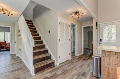 This spectacular villa offers seasonal views of Lake Petit and on Big Canoe Golf Club - Cherokee in Georgia - for sale on GolfHomes.com, golf home, golf lot