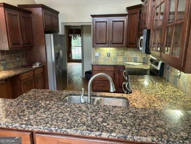 What a classy Kitchen! w/ granite countertops / worlds of on Honey Creek Country Club in Georgia - for sale on GolfHomes.com, golf home, golf lot