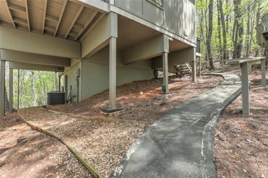 This spectacular villa offers seasonal views of Lake Petit and on Big Canoe Golf Club - Cherokee in Georgia - for sale on GolfHomes.com, golf home, golf lot