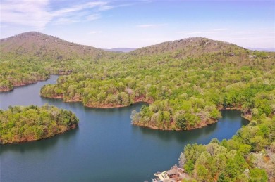 This spectacular villa offers seasonal views of Lake Petit and on Big Canoe Golf Club - Cherokee in Georgia - for sale on GolfHomes.com, golf home, golf lot