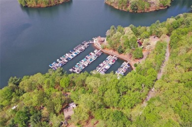 This spectacular villa offers seasonal views of Lake Petit and on Big Canoe Golf Club - Cherokee in Georgia - for sale on GolfHomes.com, golf home, golf lot
