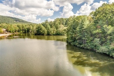 This spectacular villa offers seasonal views of Lake Petit and on Big Canoe Golf Club - Cherokee in Georgia - for sale on GolfHomes.com, golf home, golf lot