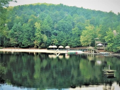 This spectacular villa offers seasonal views of Lake Petit and on Big Canoe Golf Club - Cherokee in Georgia - for sale on GolfHomes.com, golf home, golf lot