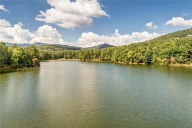 This spectacular villa offers seasonal views of Lake Petit and on Big Canoe Golf Club - Cherokee in Georgia - for sale on GolfHomes.com, golf home, golf lot