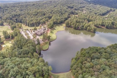 This spectacular villa offers seasonal views of Lake Petit and on Big Canoe Golf Club - Cherokee in Georgia - for sale on GolfHomes.com, golf home, golf lot