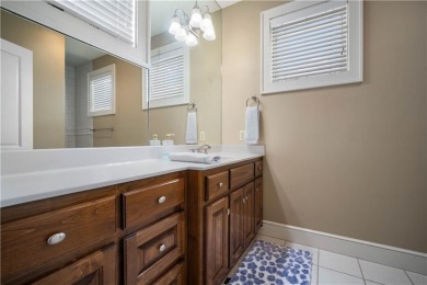 Custom built home with sweeping views of the 18th tee and the on Heron Lakes Country Club in Alabama - for sale on GolfHomes.com, golf home, golf lot