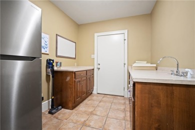 Custom built home with sweeping views of the 18th tee and the on Heron Lakes Country Club in Alabama - for sale on GolfHomes.com, golf home, golf lot