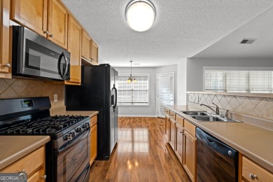 Tucked into the desirable Summergrove community, this inviting on Summergrove Golf Club in Georgia - for sale on GolfHomes.com, golf home, golf lot