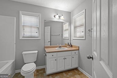 Tucked into the desirable Summergrove community, this inviting on Summergrove Golf Club in Georgia - for sale on GolfHomes.com, golf home, golf lot