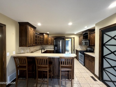 Welcome to this beautifully maintained 1.5-story home with a on Briarbrook Golf Course in Missouri - for sale on GolfHomes.com, golf home, golf lot