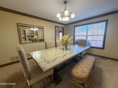 Welcome to this beautifully maintained 1.5-story home with a on Briarbrook Golf Course in Missouri - for sale on GolfHomes.com, golf home, golf lot