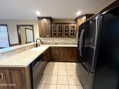 Welcome to this beautifully maintained 1.5-story home with a on Briarbrook Golf Course in Missouri - for sale on GolfHomes.com, golf home, golf lot