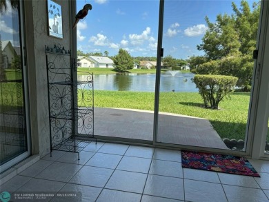 Free standing single family Waterfront home in the gated on Cypress Lakes Golf Course - West Palm Beach in Florida - for sale on GolfHomes.com, golf home, golf lot