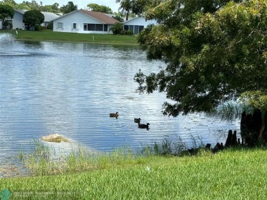 Free standing single family Waterfront home in the gated on Cypress Lakes Golf Course - West Palm Beach in Florida - for sale on GolfHomes.com, golf home, golf lot