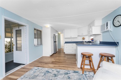 Simplify life with this charming turnkey-furnished mobile home on Boca Royale Golf and Country Club in Florida - for sale on GolfHomes.com, golf home, golf lot