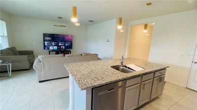 This home features a spacious open floor plan, ideal for cooking on Lake Region Yacht Country Club in Florida - for sale on GolfHomes.com, golf home, golf lot