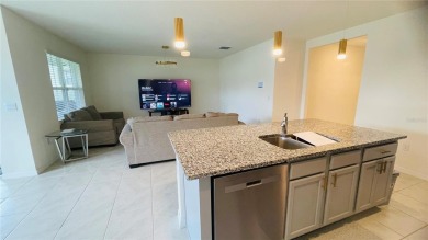 This home features a spacious open floor plan, ideal for cooking on Lake Region Yacht Country Club in Florida - for sale on GolfHomes.com, golf home, golf lot