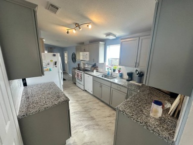Beautiful stucco home on a quiet cul de sac. Tastefully updated on Del Tura Golf and Country Club in Florida - for sale on GolfHomes.com, golf home, golf lot