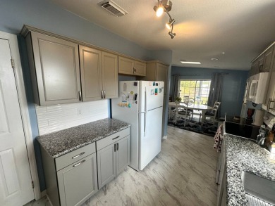 Beautiful stucco home on a quiet cul de sac. Tastefully updated on Del Tura Golf and Country Club in Florida - for sale on GolfHomes.com, golf home, golf lot