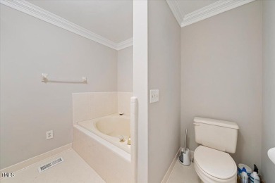 This exquisite brick townhome overlooks the 7th green of the on Lochmere Golf Club in North Carolina - for sale on GolfHomes.com, golf home, golf lot