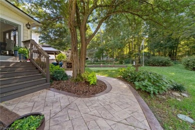 Tucked away on a quiet cul-de-sac in the prestigious Forest Oaks on Forest Oaks Country Club in North Carolina - for sale on GolfHomes.com, golf home, golf lot