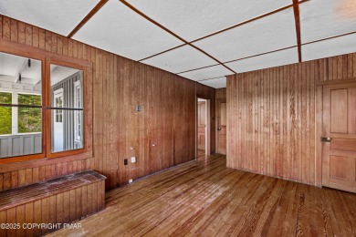 A rare architectural treasure, 'Cottage 300' is a 5-bedroom, 3 on Buck Hill Golf Club  in Pennsylvania - for sale on GolfHomes.com, golf home, golf lot