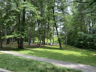 This exquisite brick townhome overlooks the 7th green of the on Lochmere Golf Club in North Carolina - for sale on GolfHomes.com, golf home, golf lot