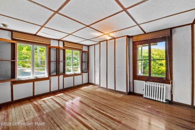 A rare architectural treasure, 'Cottage 300' is a 5-bedroom, 3 on Buck Hill Golf Club  in Pennsylvania - for sale on GolfHomes.com, golf home, golf lot