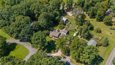 Tucked away on a quiet cul-de-sac in the prestigious Forest Oaks on Forest Oaks Country Club in North Carolina - for sale on GolfHomes.com, golf home, golf lot