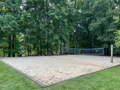 This exquisite brick townhome bathed in natural light overlooks on Lochmere Golf Club in North Carolina - for sale on GolfHomes.com, golf home, golf lot