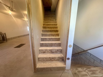 This home offers a rare opportunity to put your own finishing on Escanaba Country Club in Michigan - for sale on GolfHomes.com, golf home, golf lot