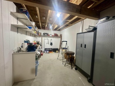 This home offers a rare opportunity to put your own finishing on Escanaba Country Club in Michigan - for sale on GolfHomes.com, golf home, golf lot