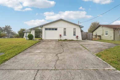 Welcome to your dream home, beautifully nestled on an oversized on Palm Harbor Golf Club in Florida - for sale on GolfHomes.com, golf home, golf lot