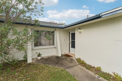 Welcome to your dream home, beautifully nestled on an oversized on Palm Harbor Golf Club in Florida - for sale on GolfHomes.com, golf home, golf lot