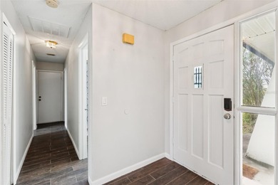 Welcome to your dream home, beautifully nestled on an oversized on Palm Harbor Golf Club in Florida - for sale on GolfHomes.com, golf home, golf lot