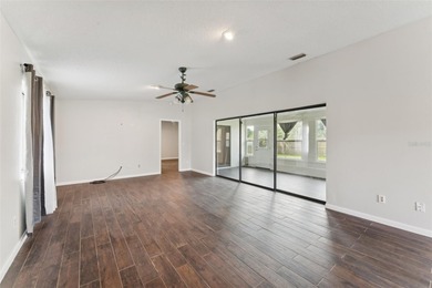 Welcome to your dream home, beautifully nestled on an oversized on Palm Harbor Golf Club in Florida - for sale on GolfHomes.com, golf home, golf lot