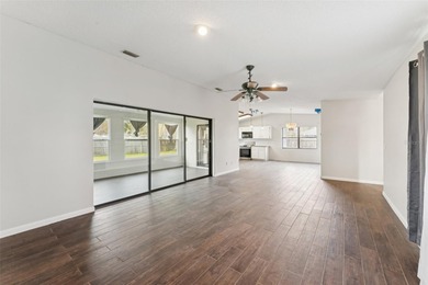 Welcome to your dream home, beautifully nestled on an oversized on Palm Harbor Golf Club in Florida - for sale on GolfHomes.com, golf home, golf lot