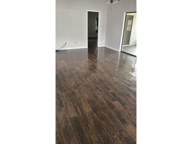 Welcome to your dream home, beautifully nestled on an oversized on Palm Harbor Golf Club in Florida - for sale on GolfHomes.com, golf home, golf lot