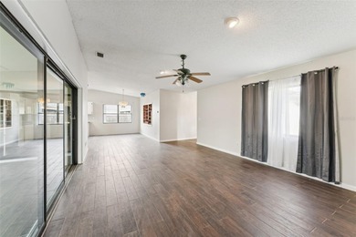 Welcome to your dream home, beautifully nestled on an oversized on Palm Harbor Golf Club in Florida - for sale on GolfHomes.com, golf home, golf lot