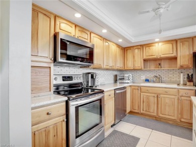 Discover this charming 2-bedroom, 2-bath waterfront home on The Glades Golf and Country Club in Florida - for sale on GolfHomes.com, golf home, golf lot