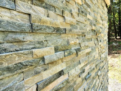 Experience the ultimate POCONO RETREAT!! This stunning raised on The Hideout Golf in Pennsylvania - for sale on GolfHomes.com, golf home, golf lot